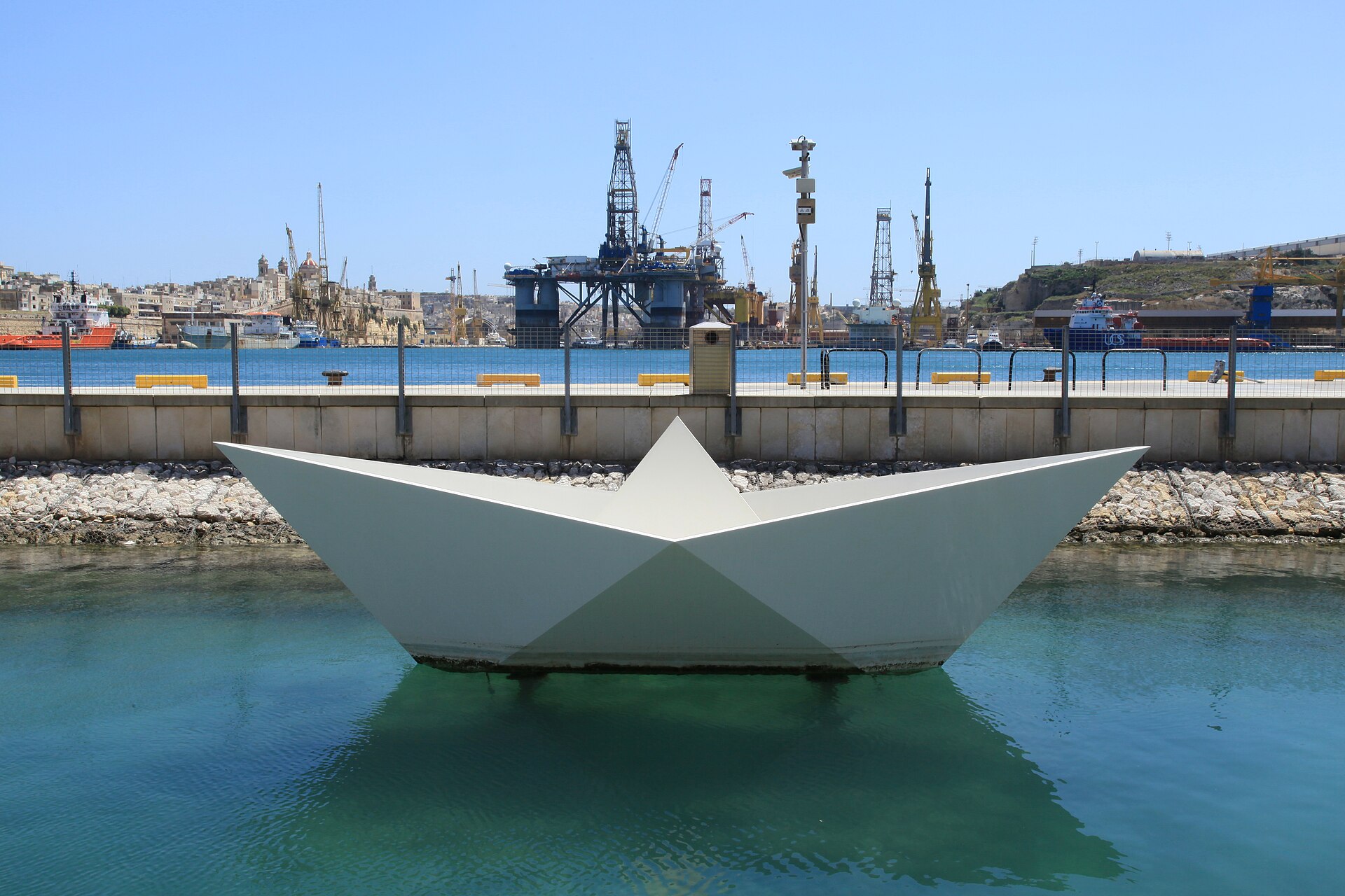 The Child Migrants' Memorial, a large white paper-boat sculpture at Laguna Marina, Valletta Waterfront, Floriana, Malta